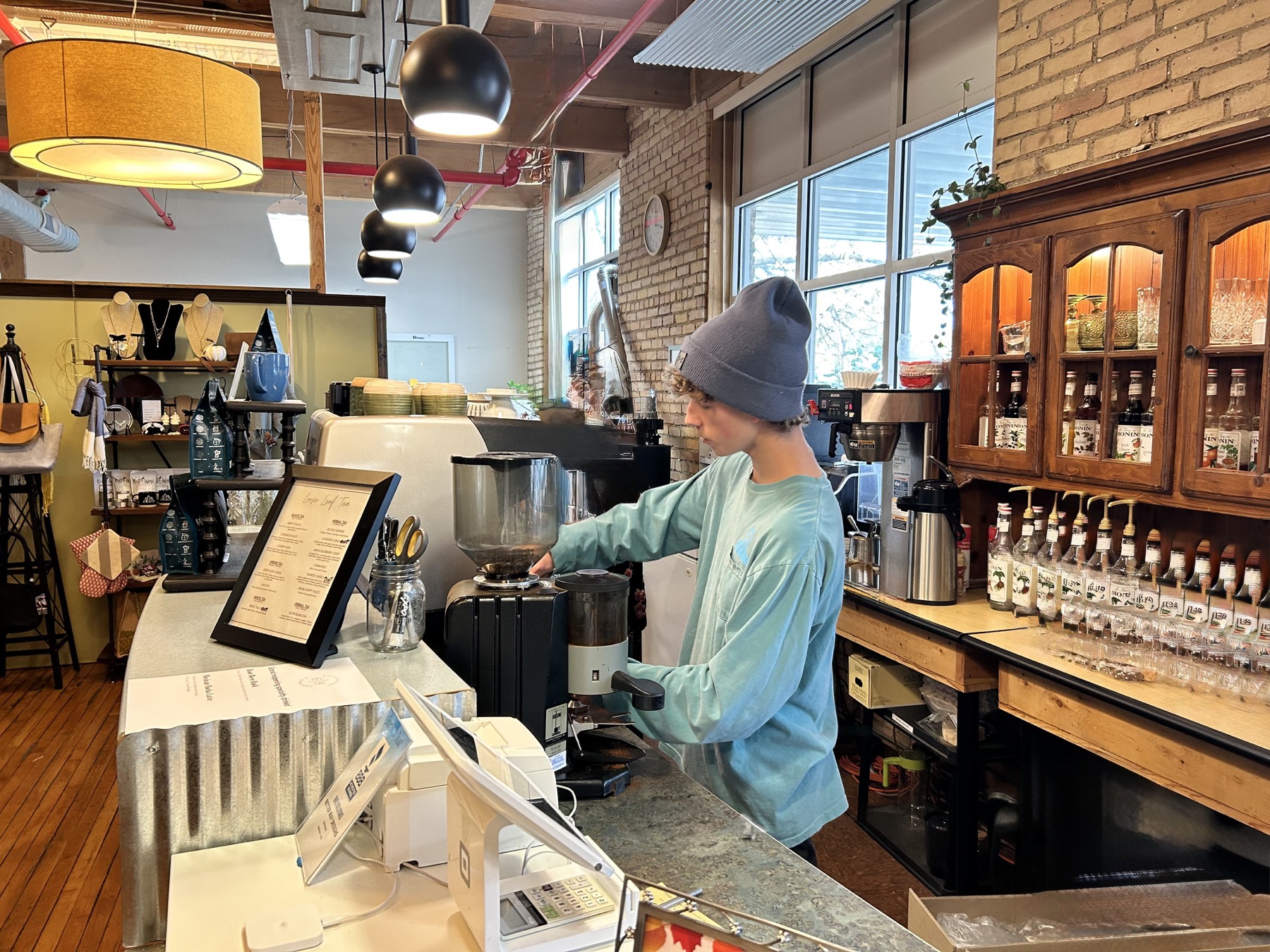 6eight team member preparing coffee behind the bar