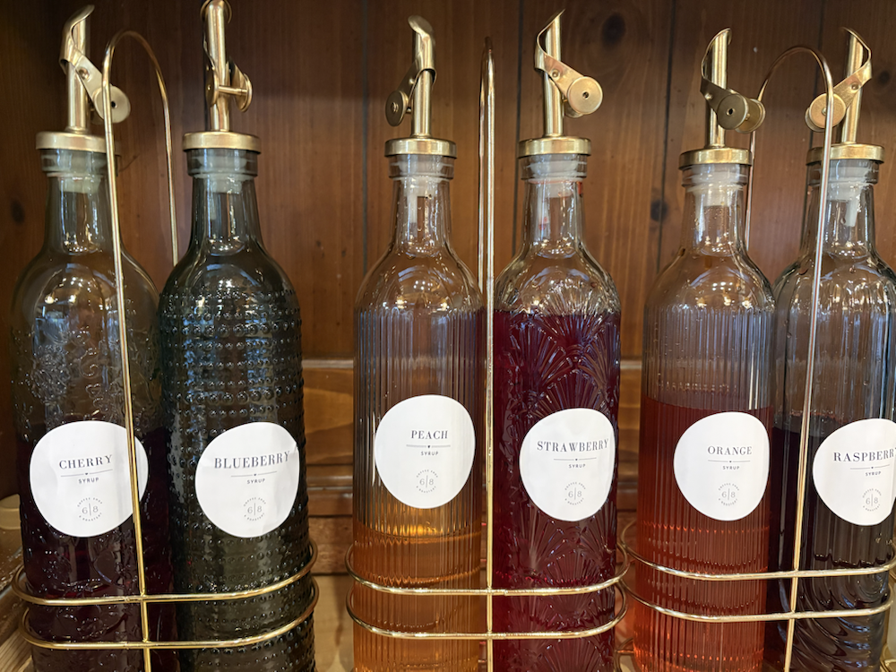 House-made syrup bottles at 6eight Coffee Shop
